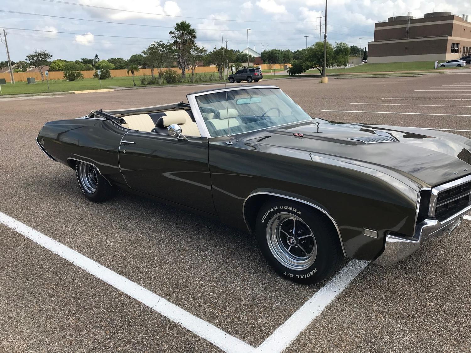 Finished 1969 Buick GS 400 convertible in olive green with a white interior, back on the road