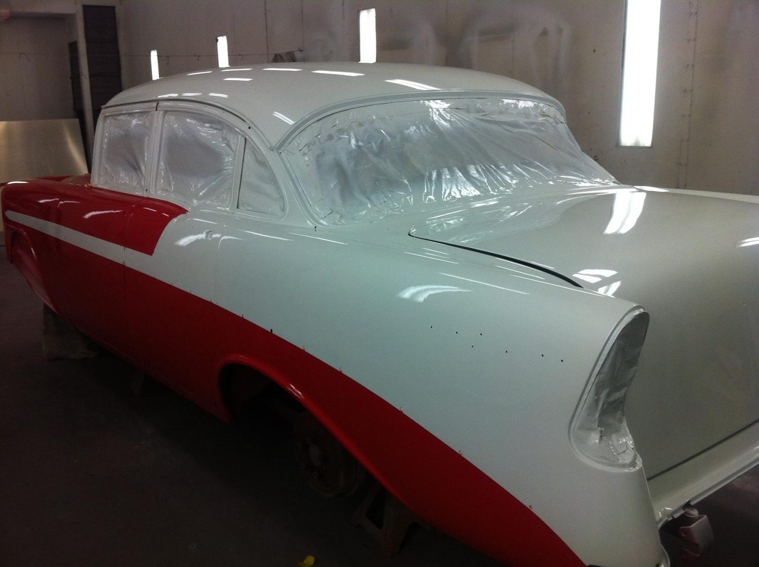 1956 Chevrolet in a red and white two-tone paint scheme