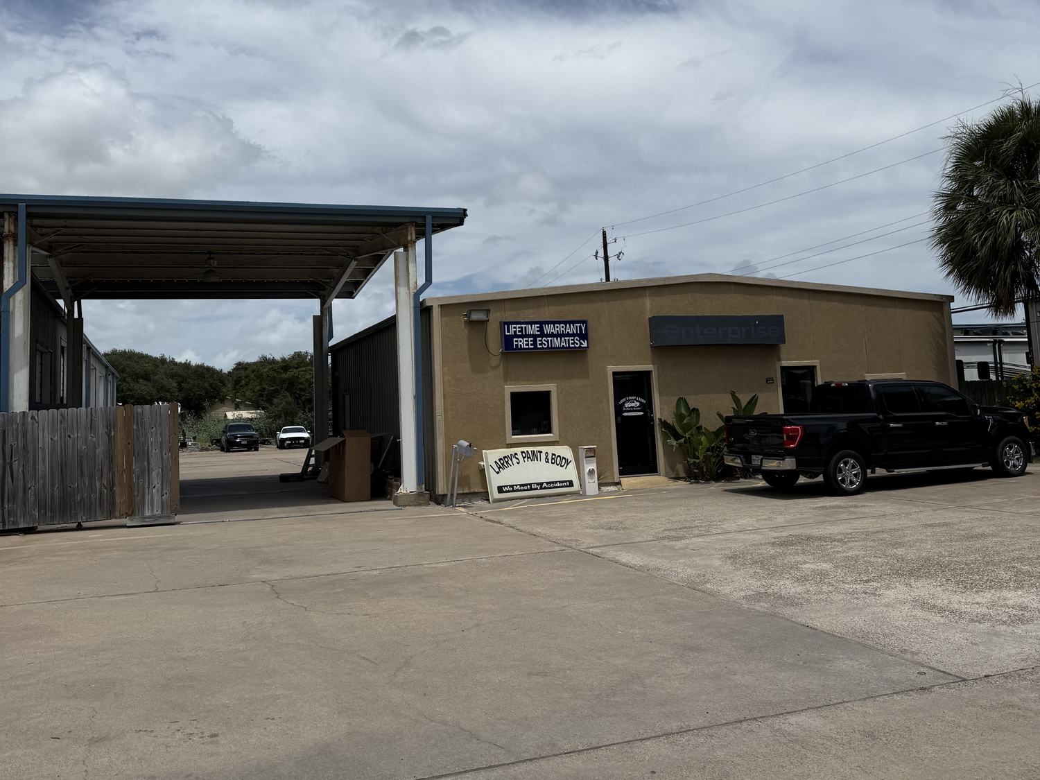 The office and drive-through bay at Larry's Paint & Body Shop on West Market Street in Rockport, Texas